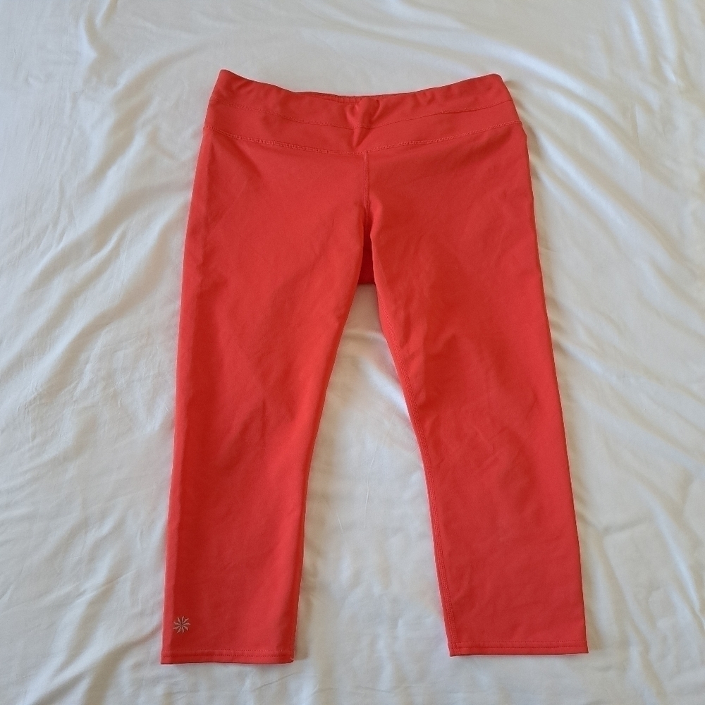Athleta womens cropped orange pants EUC size Large